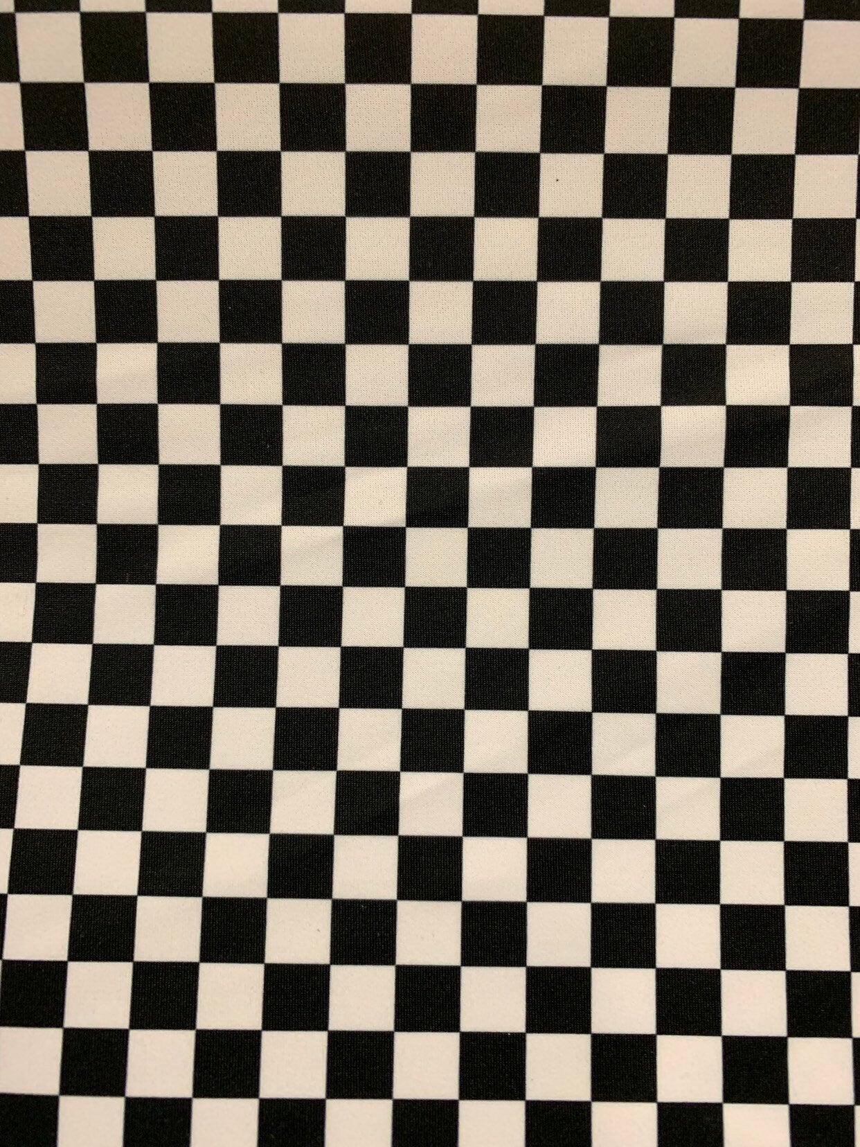 New small checkered design size 1/2 inch nylon spandex 4way stretch 58/60" Sold by the YD. Ships worldwide from Los Angeles California USA.