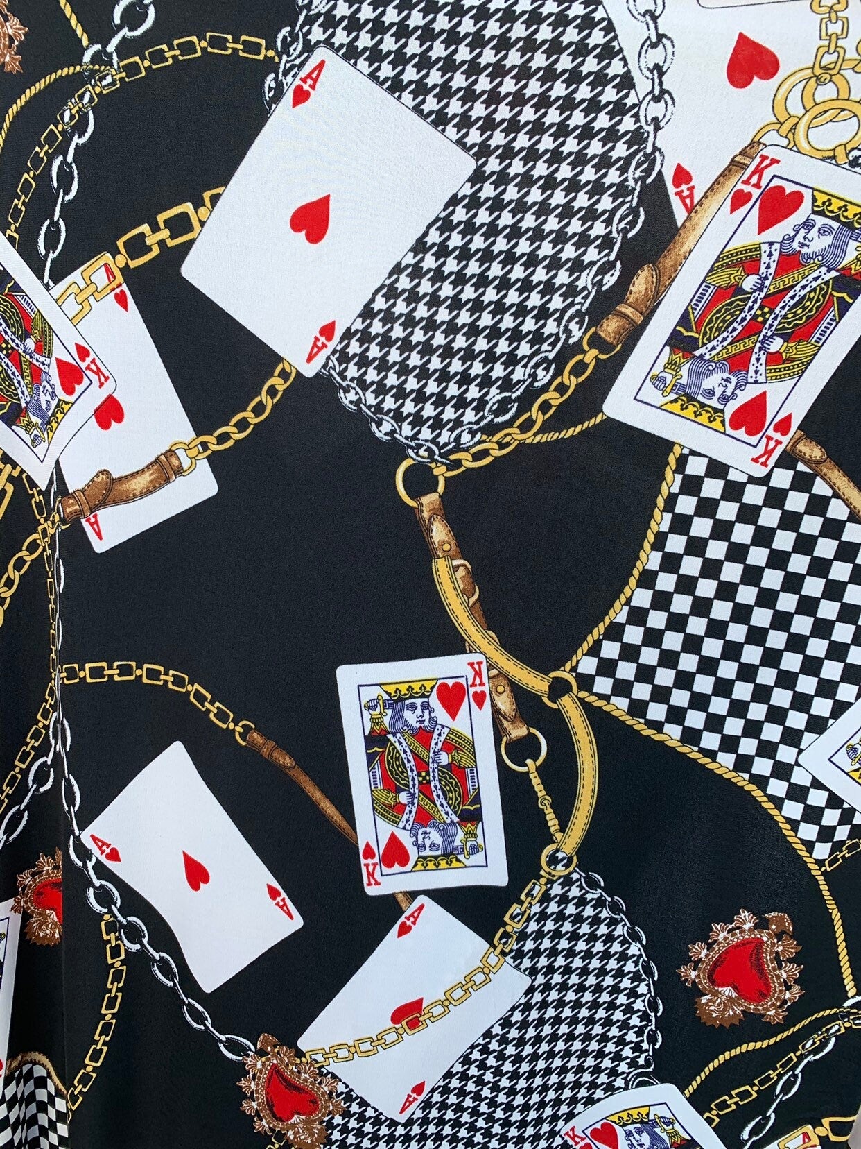 Multi chain and playing cards design print on nylon spandex 4way stretch 58/60" Sold by the YD. Ships worldwide from Los Angeles California.