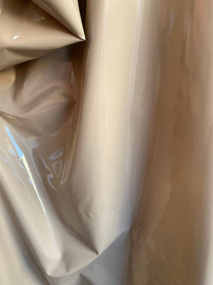 Shiny taupe Latex nylon spandex 4way stretch 58/60" Sold by the YD. Ships worldwide from Los Angeles California USA.