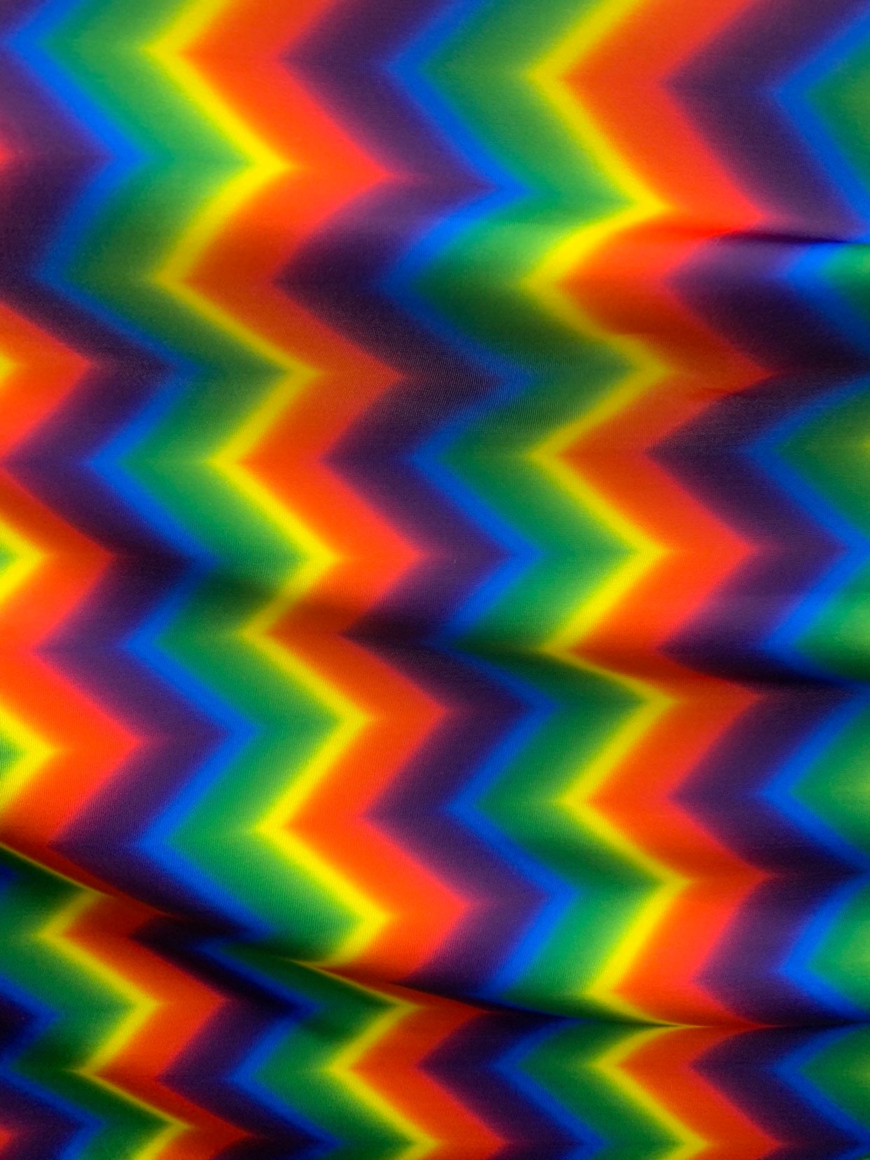 New rainbow chevron print on nylon spandex 4way Stretch 58/60" Sold by the YD. Ships worldwide from Los Ángeles California USA.