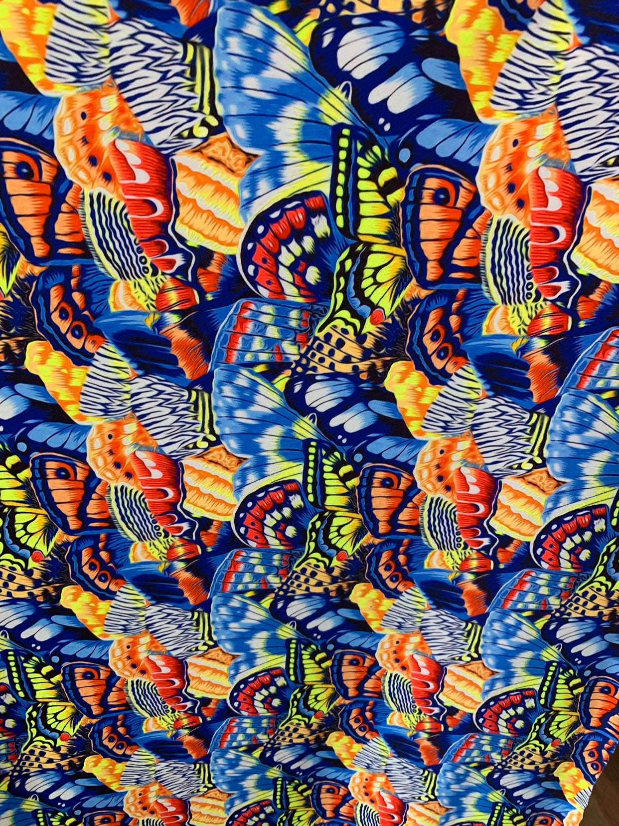 New multi butterflies design multicolor print on heavy nylon spandex 4way stretch 58/60" Sold by the YD. Ships worldwide from Los Angeles CA