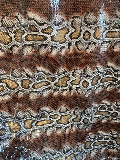 Snake design brown/gold with clear sequins all over spandex base 2way 58/60" Sold by the YD. Ships worldwide from Los Ángeles California USA