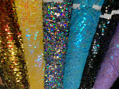 New raindrops sequins medium size on stretch mesh 2 way 55/57" Sold by the YD. Ships worldwide from Los Angeles California USA.