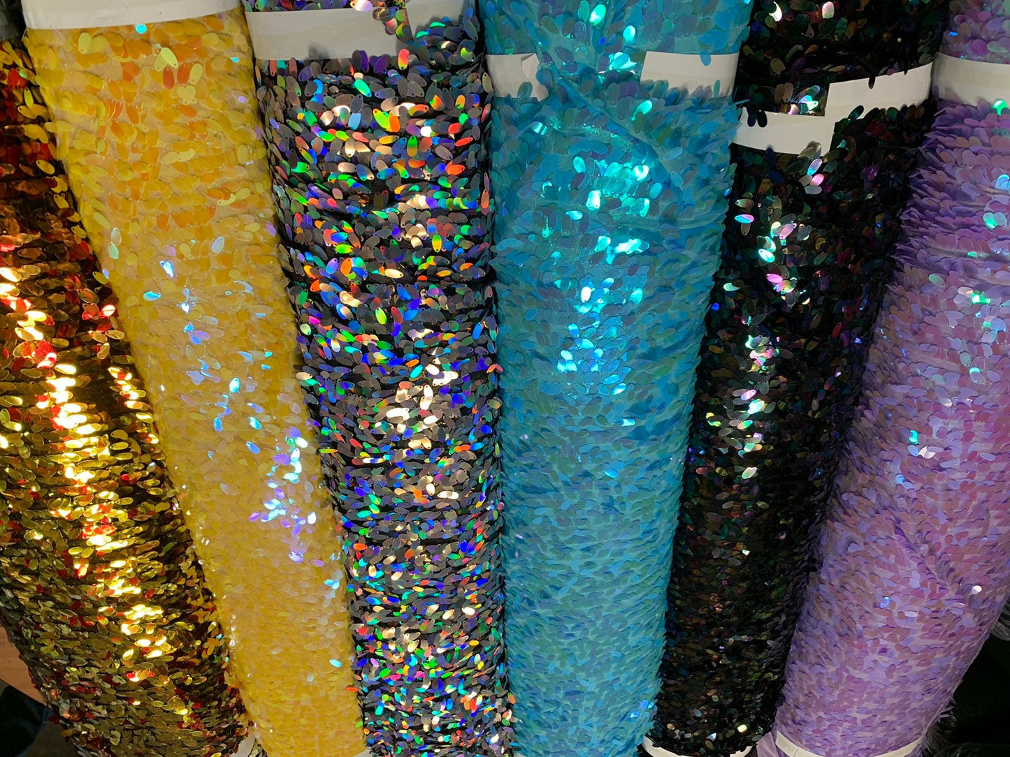 New raindrops sequins medium size on stretch mesh 2 way 55/57" Sold by the YD. Ships worldwide from Los Angeles California USA.