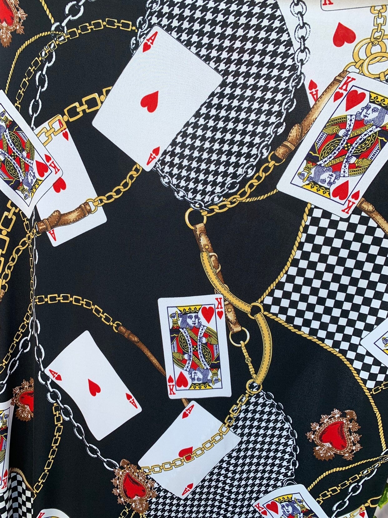 Multi chain and playing cards design print on nylon spandex 4way stretch 58/60" Sold by the YD. Ships worldwide from Los Angeles California.