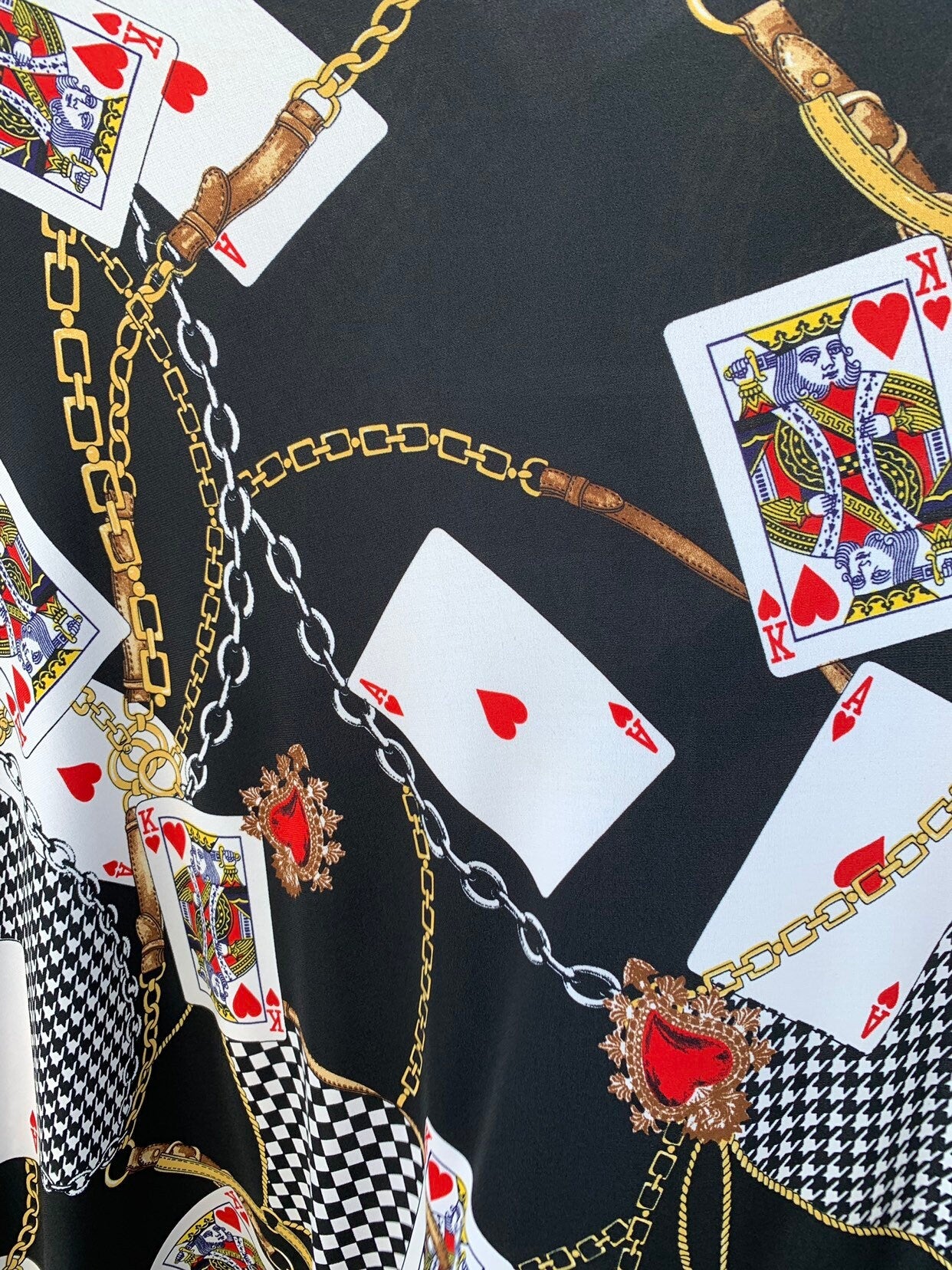 Multi chain and playing cards design print on nylon spandex 4way stretch 58/60" Sold by the YD. Ships worldwide from Los Angeles California.