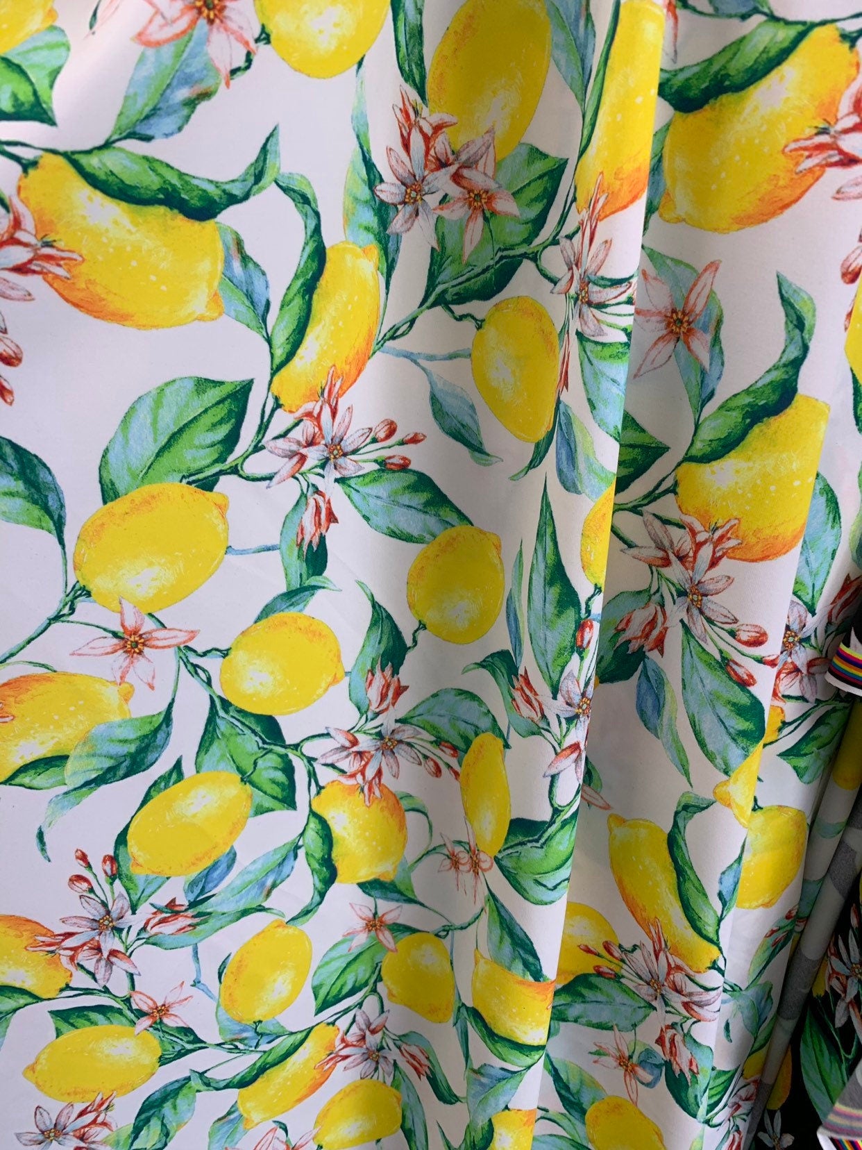 New yellow lemons design print on fine quality of nylon spandex 4way spandex 58/60" Sold by the YD. Ships worldwide from Los Angeles CA USA