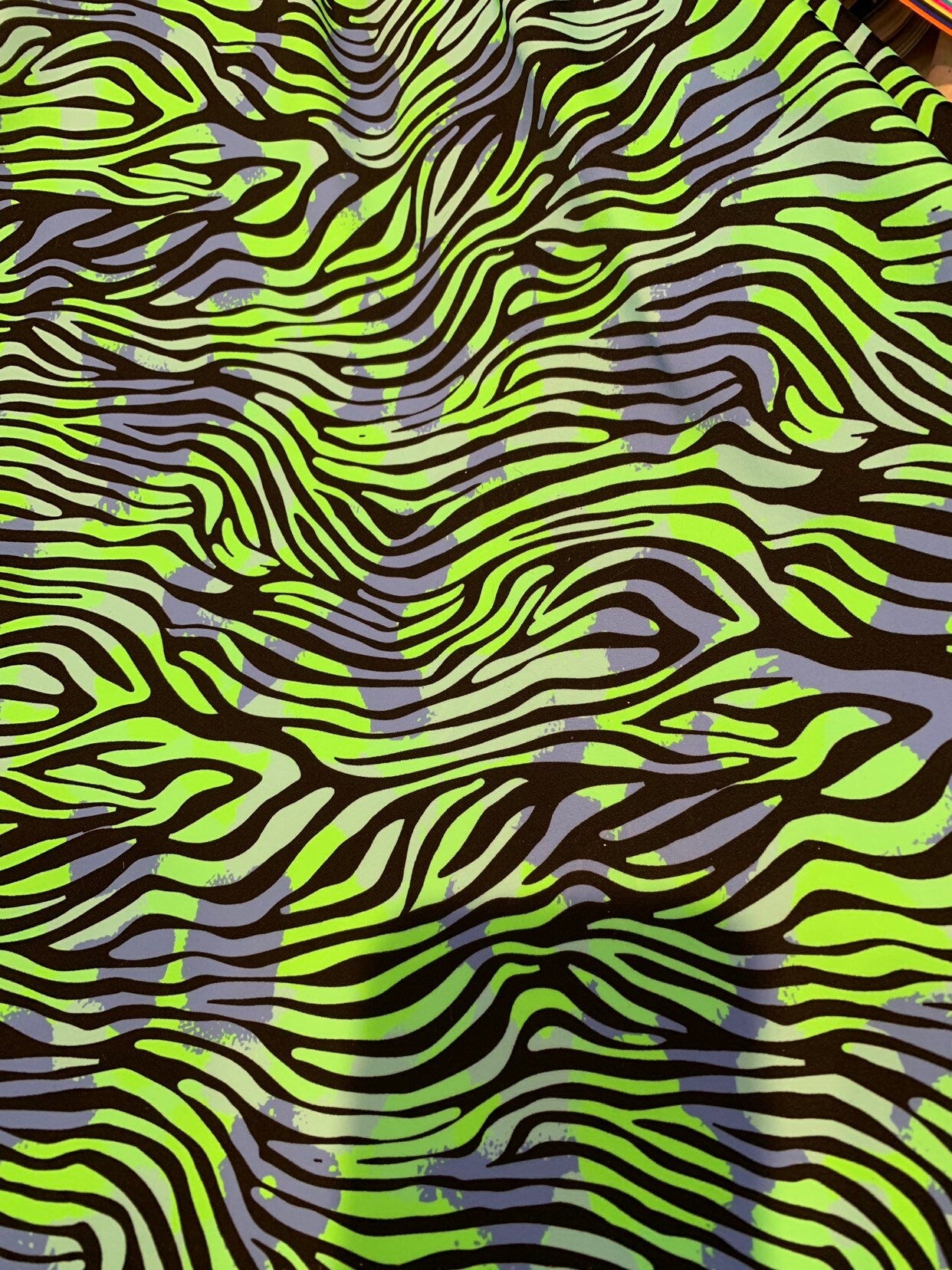 New zebra design Neon green print on heavy nylon spandex 4way stretch 58/60" Sold by the YD. Ships worldwide from Los Angeles California USA