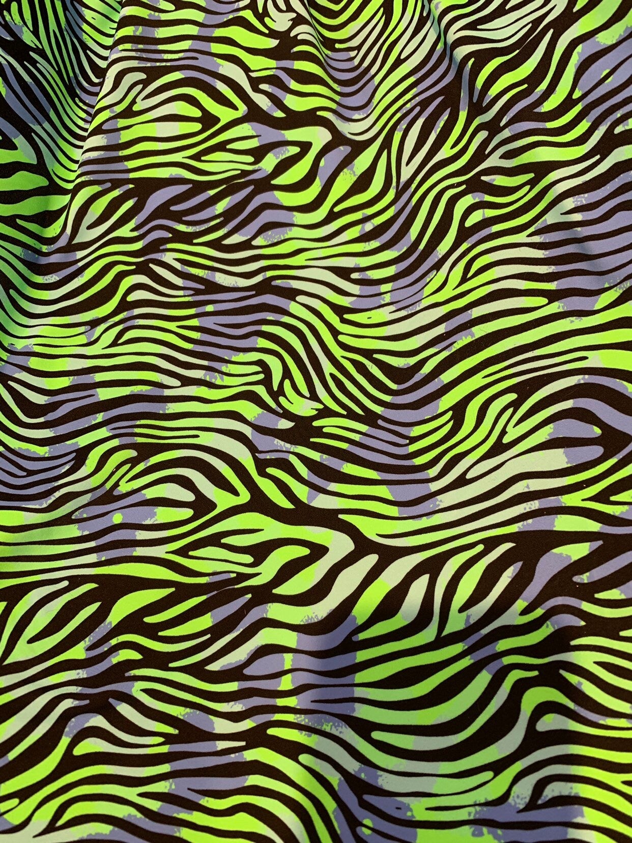 New zebra design Neon green print on heavy nylon spandex 4way stretch 58/60" Sold by the YD. Ships worldwide from Los Angeles California USA