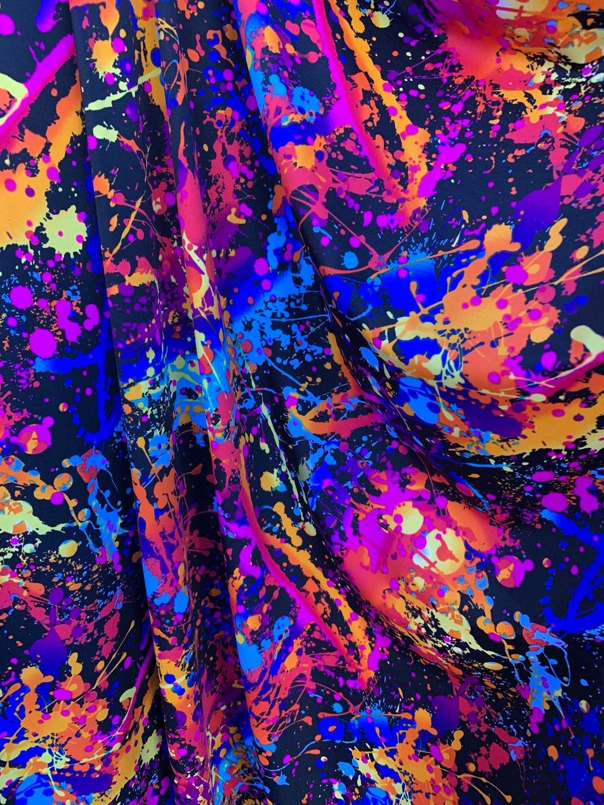 Graffiti paint design nylon spandex 4 way stretch. 58/60" sold by the YD. Ships worldwide from Los Angeles California United States.