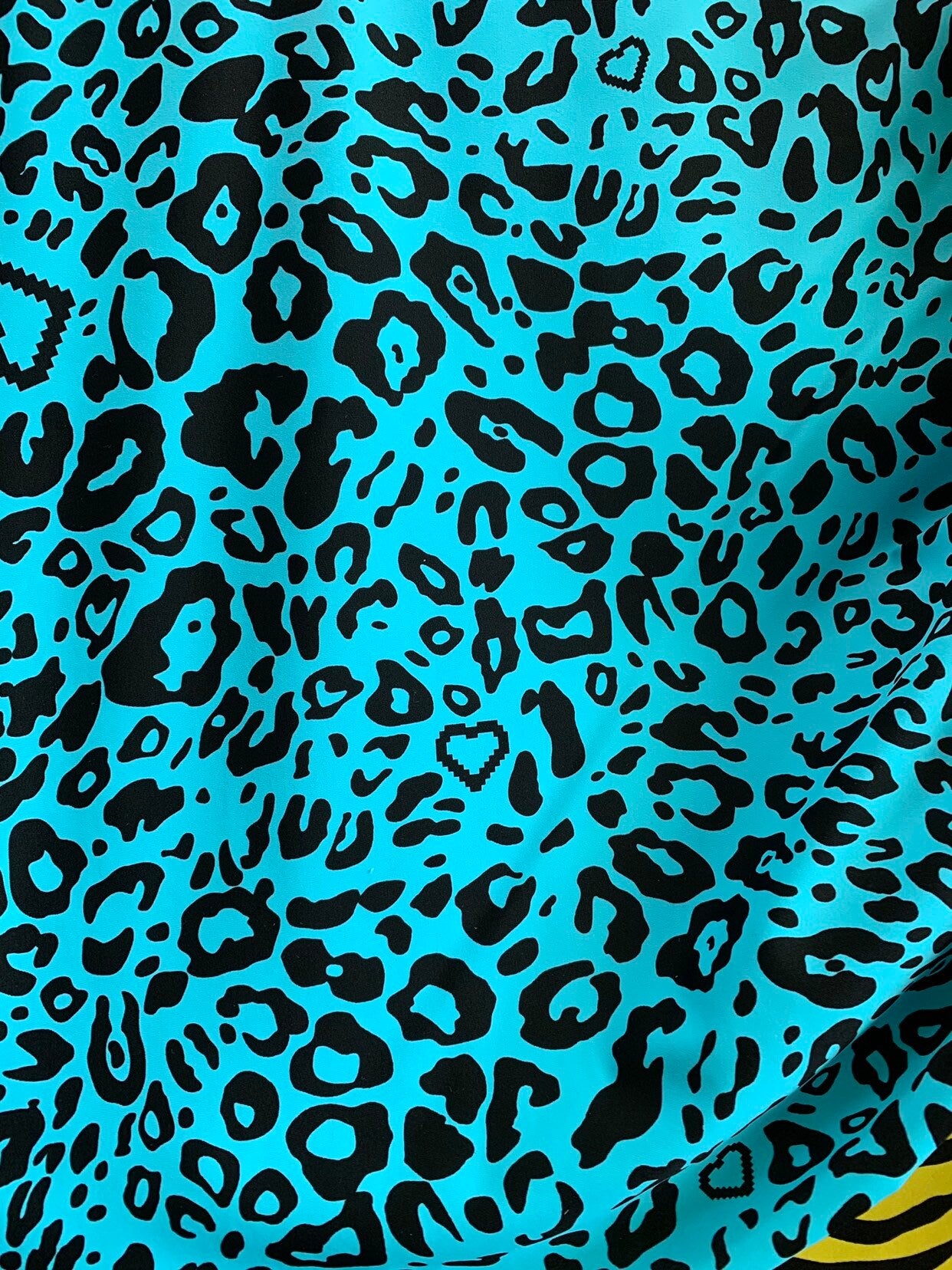 New leopard design blue/black nylon spandex 4way stretch 58/60" Sold by the YD. Ships worldwide from Los Angeles California USA.