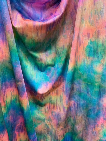 New tie dye rainbow colors with silver foil all over nylon spandex 4way stretch 58/60" Sold by the YD. Ships worldwide from Los Angeles CA.