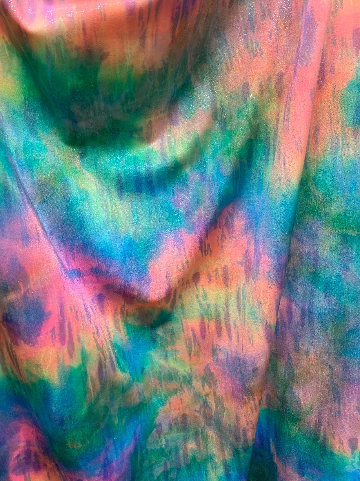 New tie dye rainbow colors with silver foil all over nylon spandex 4way stretch 58/60" Sold by the YD. Ships worldwide from Los Angeles CA.