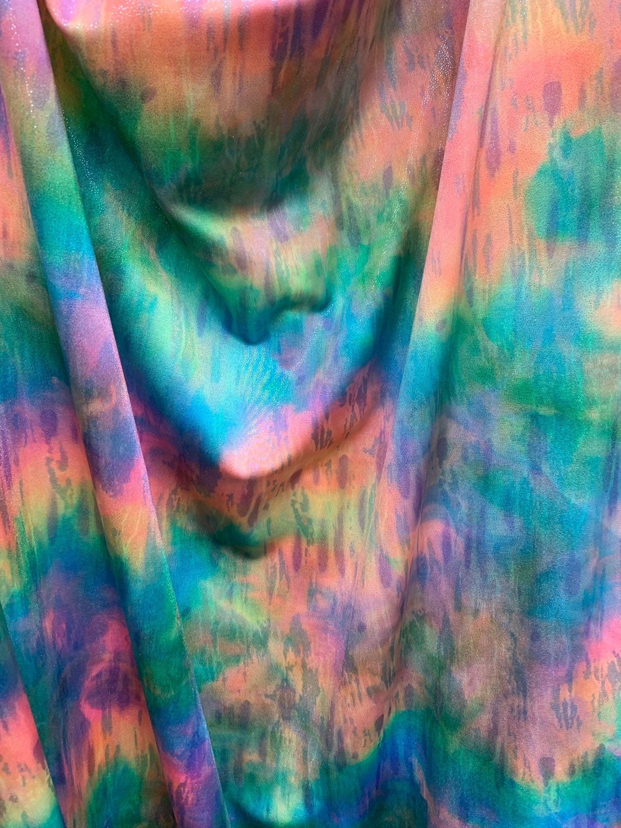 New tie dye rainbow colors with silver foil all over nylon spandex 4way stretch 58/60" Sold by the YD. Ships worldwide from Los Angeles CA.