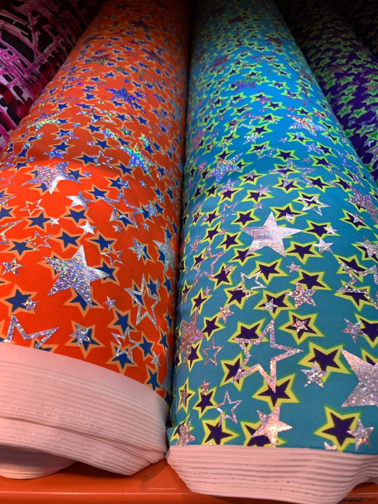 New hologram metallic stars design print on heavy nylon spandex 4way stretch 58/60" Sold by the YD. Ships worldwide from Los Angeles CA USA.