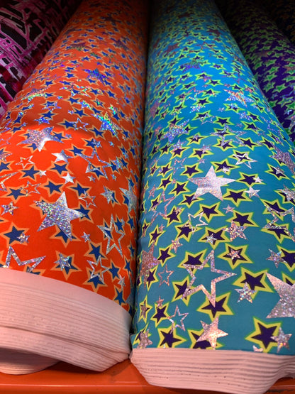 New hologram metallic stars design print on heavy nylon spandex 4way stretch 58/60" Sold by the YD. Ships worldwide from Los Angeles CA USA.