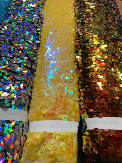 New raindrops sequins medium size on stretch mesh 2 way 55/57" Sold by the YD. Ships worldwide from Los Angeles California USA.