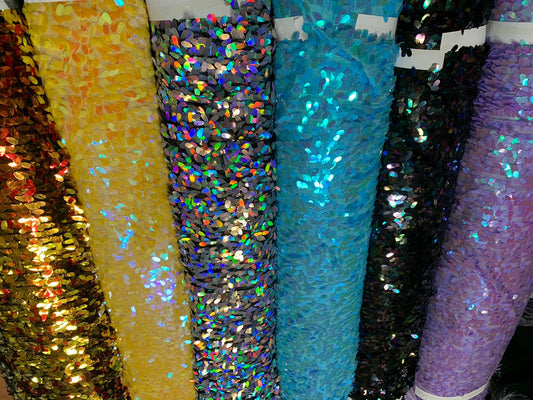 New raindrops sequins medium size on stretch mesh 2 way 55/57" Sold by the YD. Ships worldwide from Los Angeles California USA.