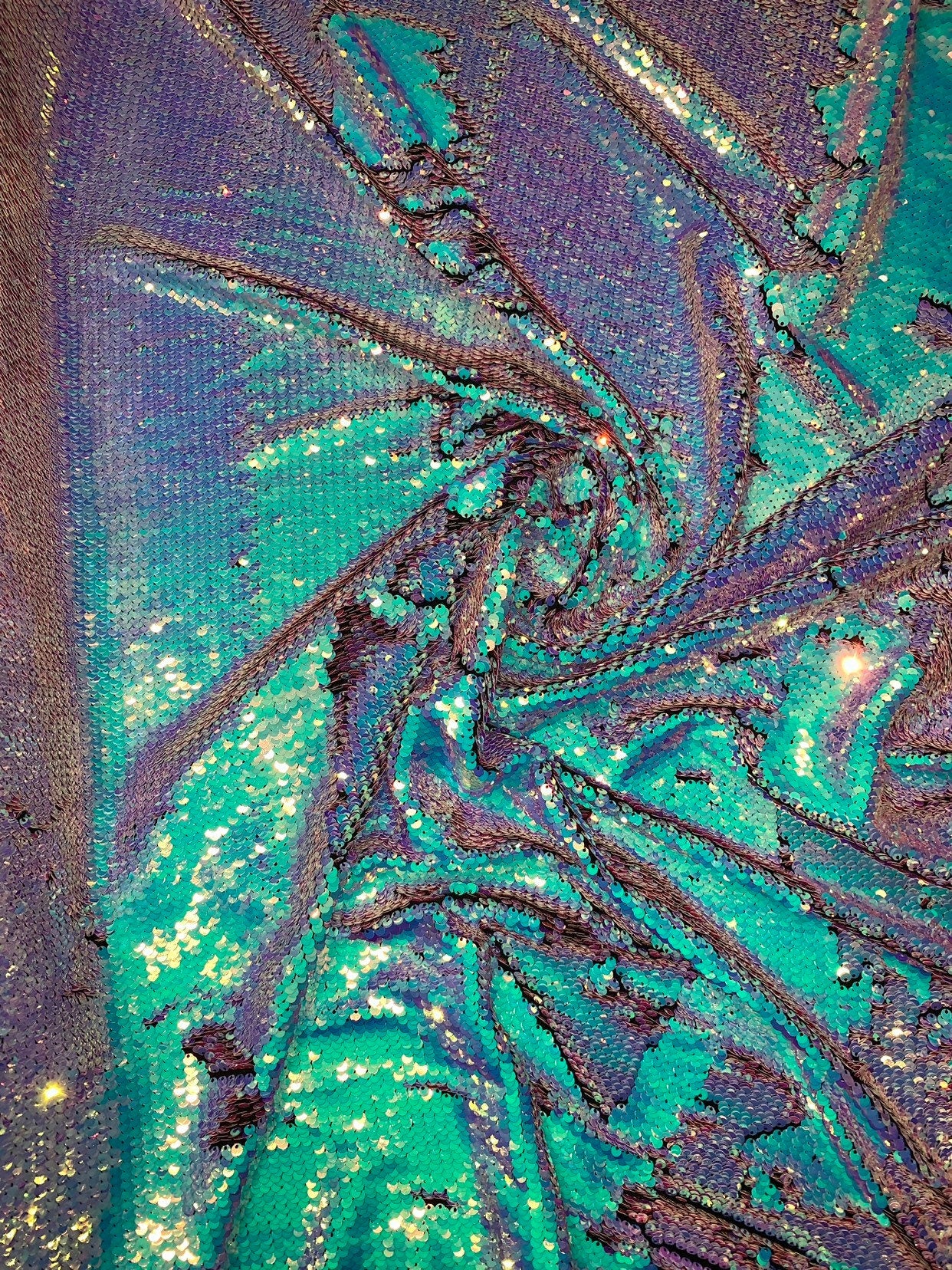 New Unicorn iridescent blue/pink reversible sequins on spandex base 2way stretch 58/60" Sold by the YD. Ships worldwide from Los Angeles CA.