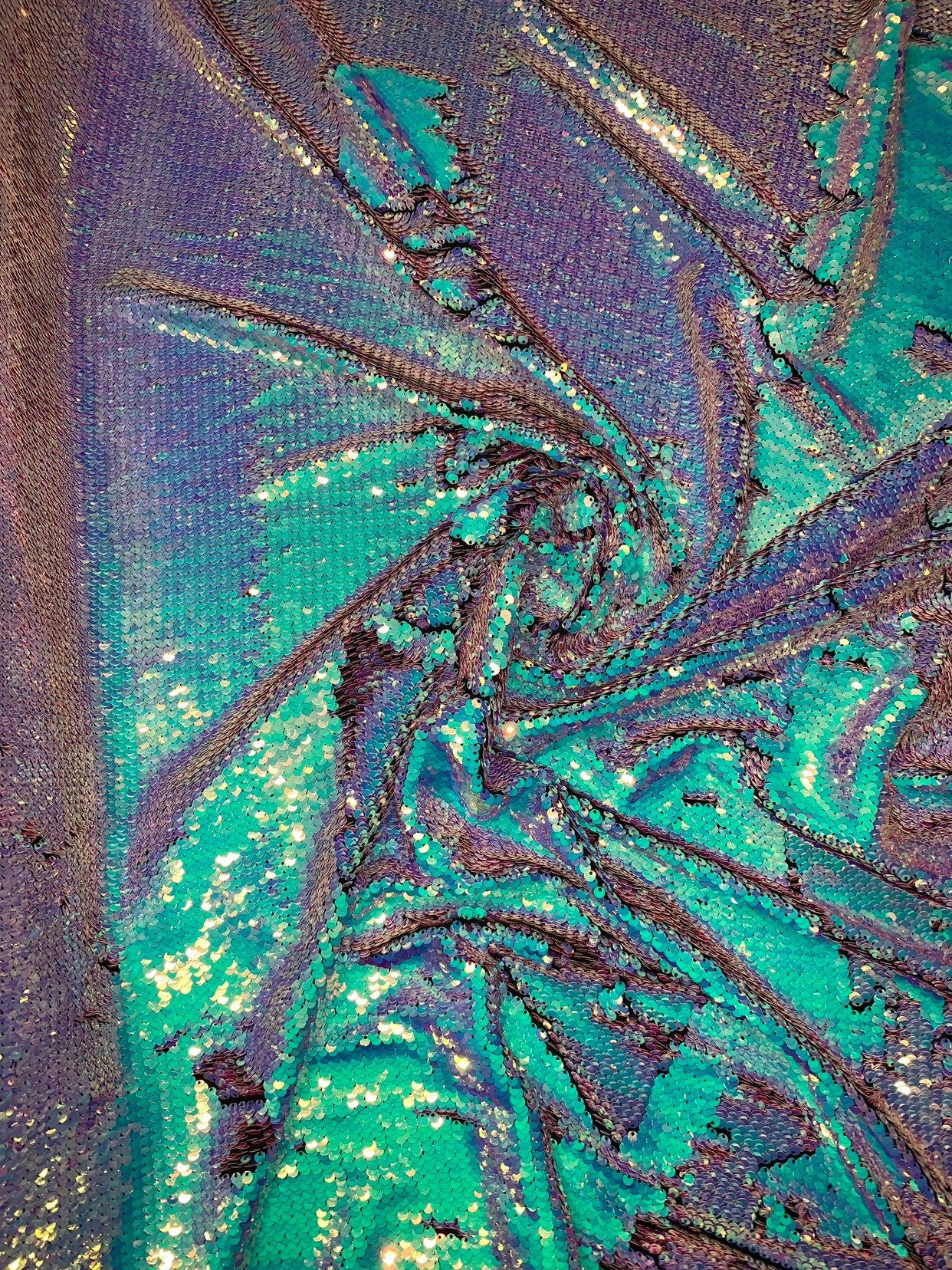 New Unicorn iridescent blue/pink reversible sequins on spandex base 2way stretch 58/60" Sold by the YD. Ships worldwide from Los Angeles CA.