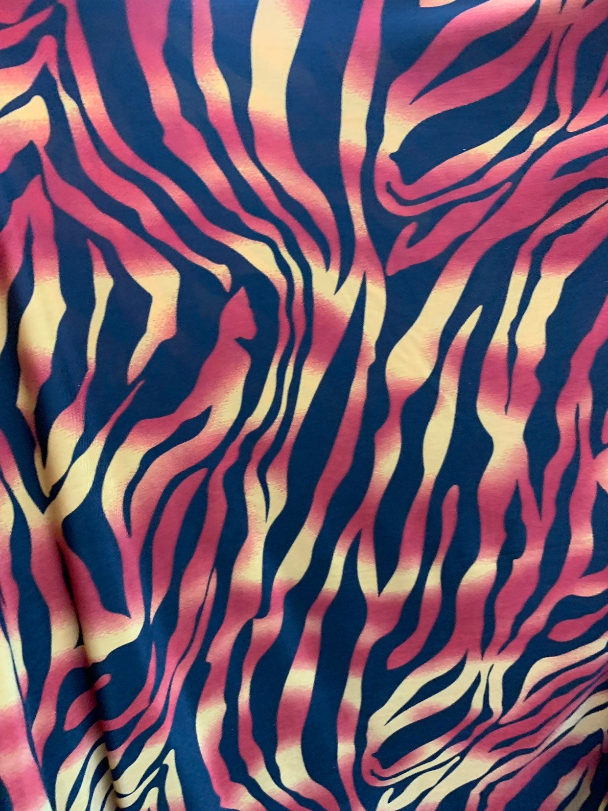 New tiger design print on medium weight spandex 4way stretch 58/60" Sold by the YD. Ships worldwide from Los Angeles California USA.