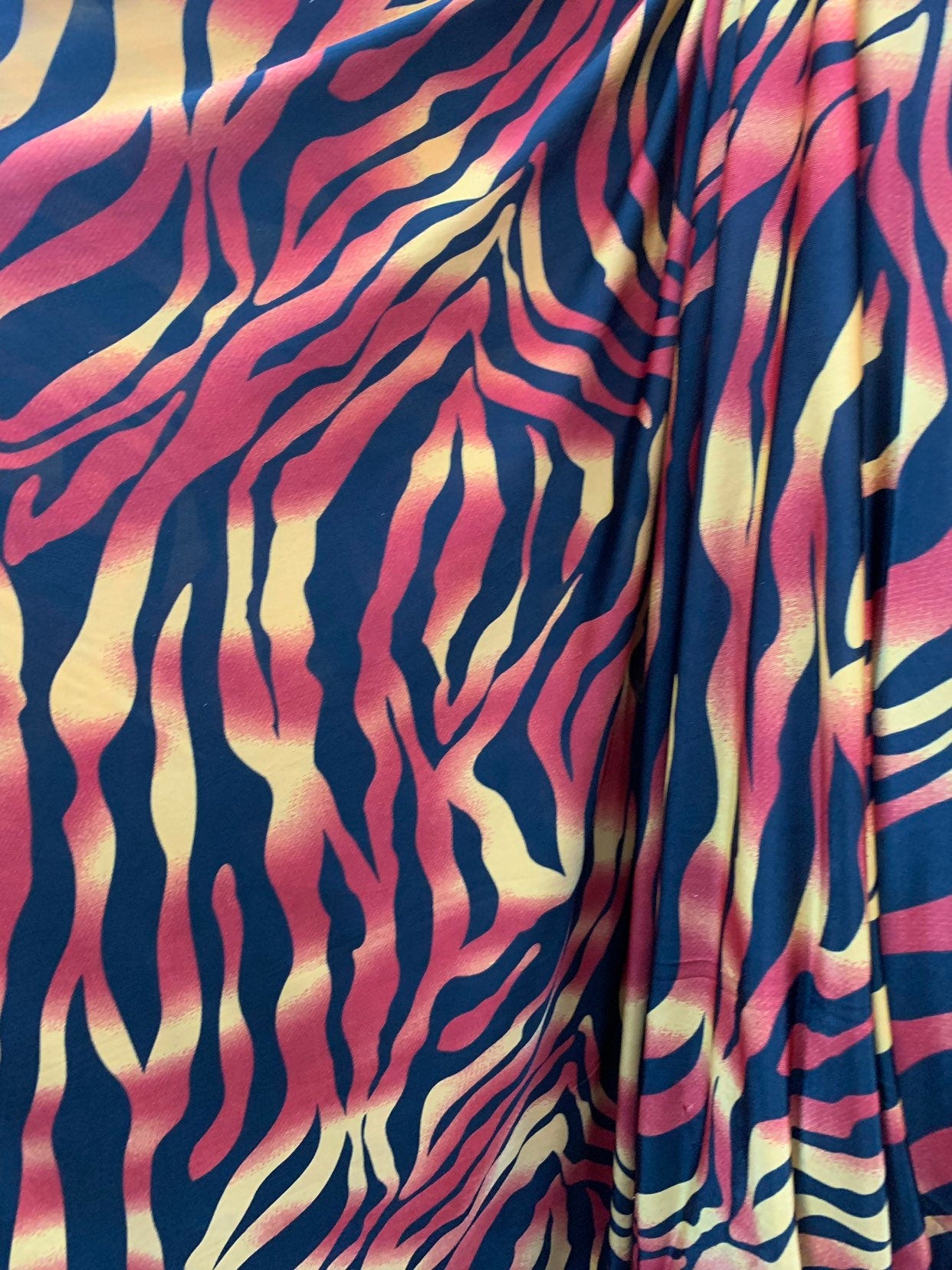 New tiger design print on medium weight spandex 4way stretch 58/60" Sold by the YD. Ships worldwide from Los Angeles California USA.