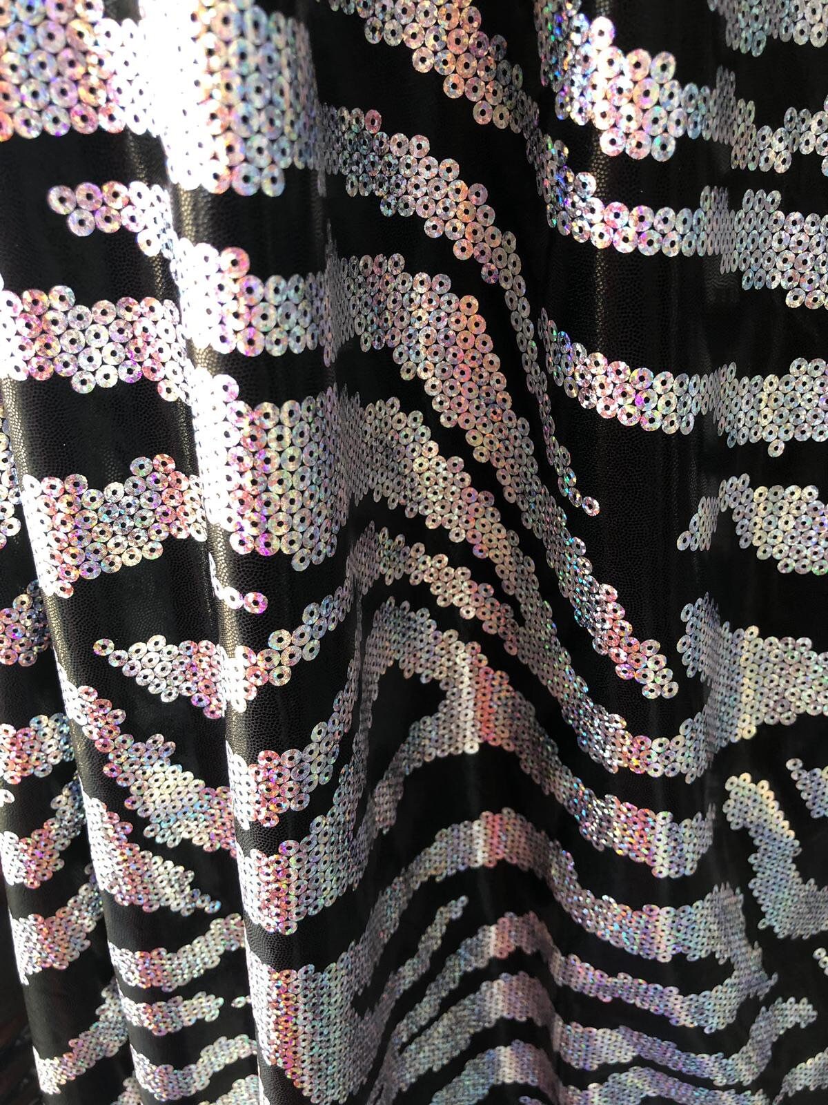 New metallic nylon spandex sequins zebra looking with foggy foil all over 4way stretch 58/60" Sold by the YD. Ships worldwide from L.A CA