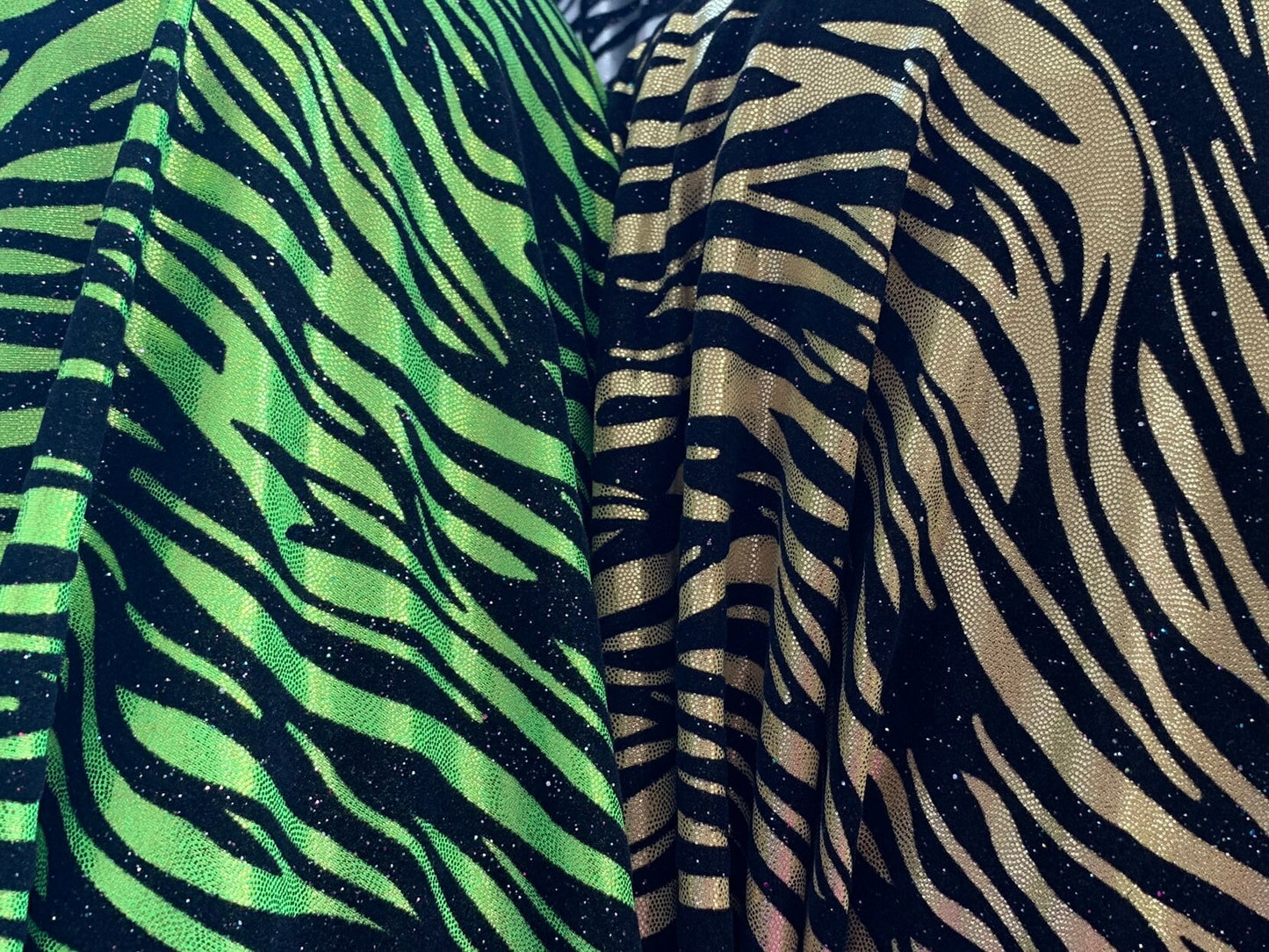 New zebra design with black flocking metallic nylon spandex 4-Way stretch 58/60" Sold by the YD. Ships worldwide from Los Angeles