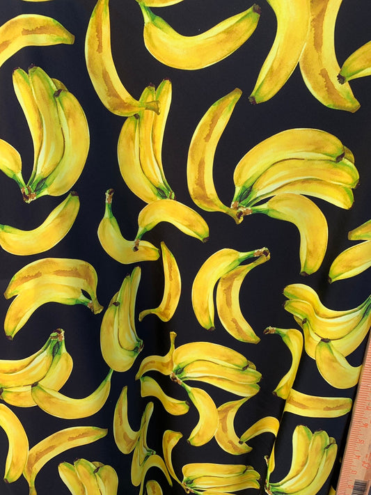 New bananas design black/yellow print on nylon spandex 4way stretch 58/60" Sold by the YD. Ships worldwide from Los Angeles California USA.