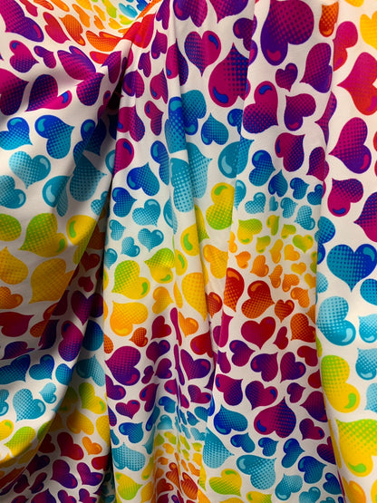 Multi heart design print on nylon spandex 4way Stretch 58/60" Sold by the yd. Ships worldwide from Los Angeles California USA