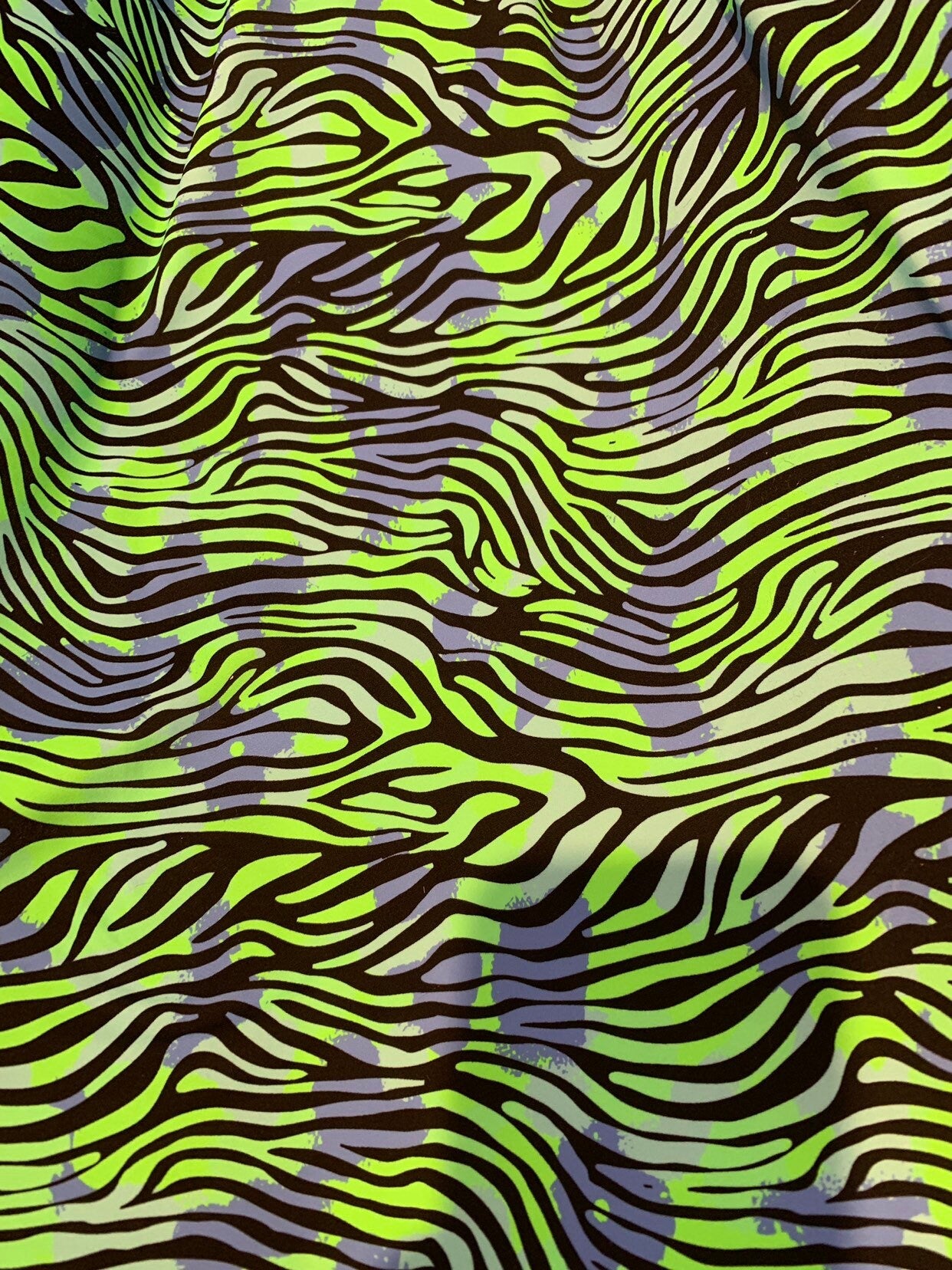 New zebra design Neon green print on heavy nylon spandex 4way stretch 58/60" Sold by the YD. Ships worldwide from Los Angeles California USA