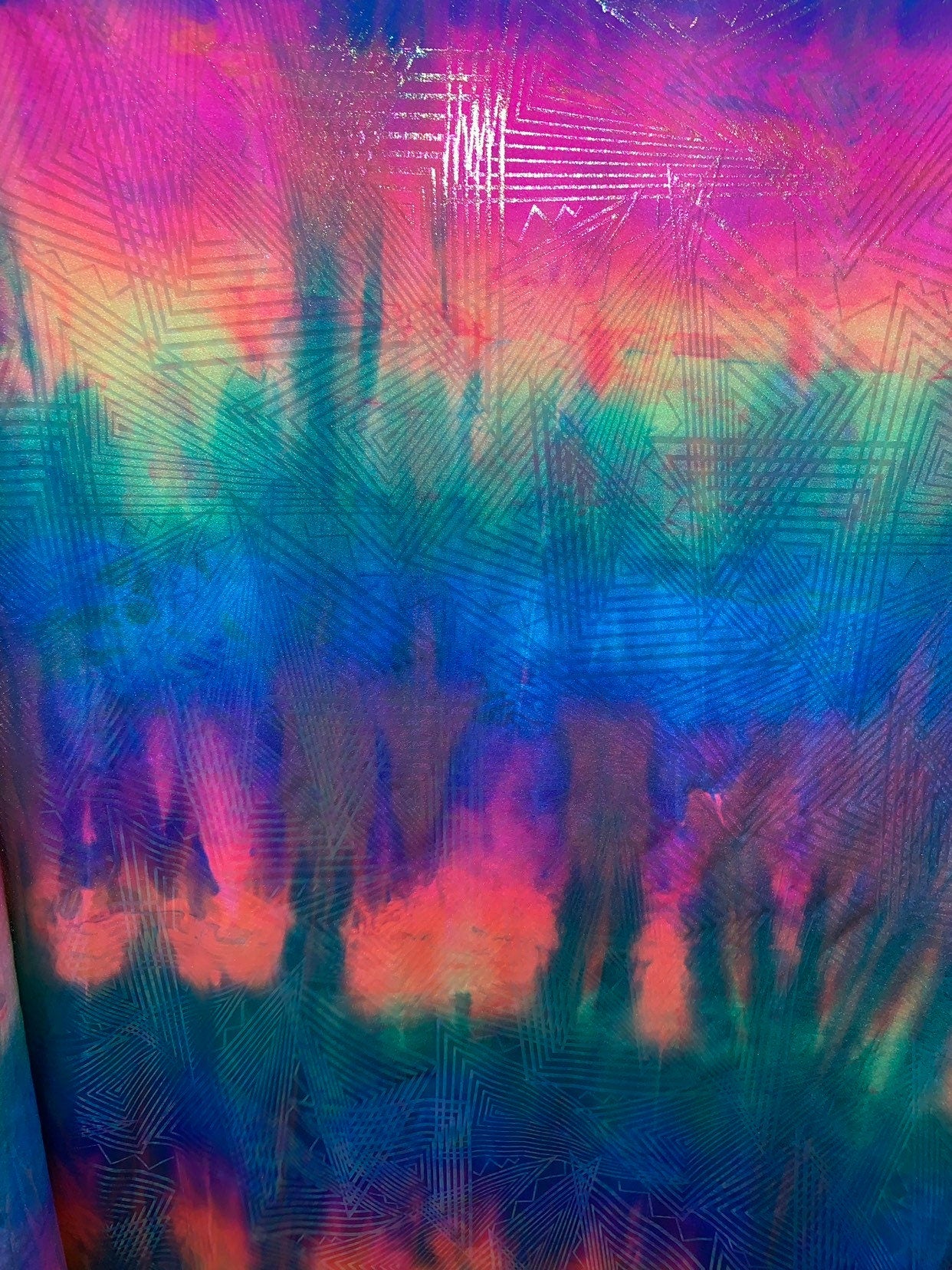 New tie dye rainbow geometric design with ilusión clear foil iridescent nylon spandex 4way stretch 58/60" Sold by the YD. Ships worldwide