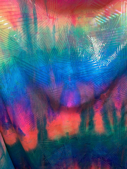 New tie dye rainbow geometric design with ilusión clear foil iridescent nylon spandex 4way stretch 58/60" Sold by the YD. Ships worldwide