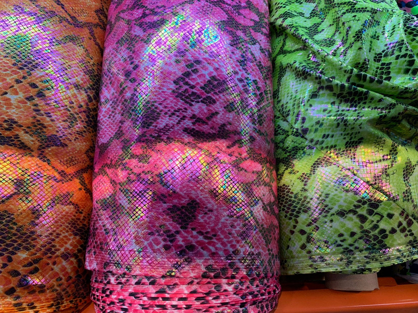 New Iridescent Cobra snake design with holo ilusión foil all over print in nylon spandex 4way stretch 58/60" Sold by the YD. Ships worldwide