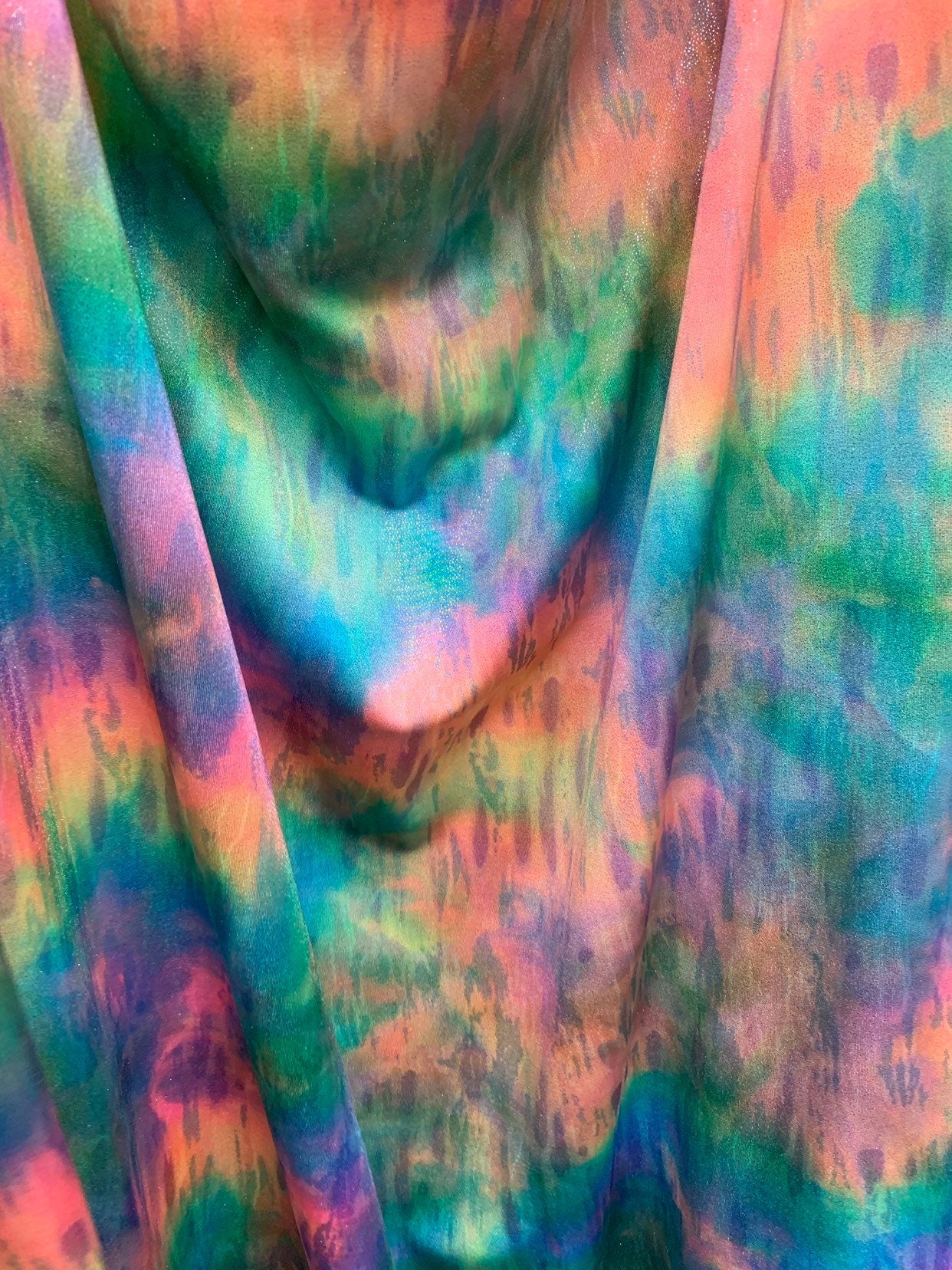 New tie dye rainbow colors with silver foil all over nylon spandex 4way stretch 58/60" Sold by the YD. Ships worldwide from Los Angeles CA.