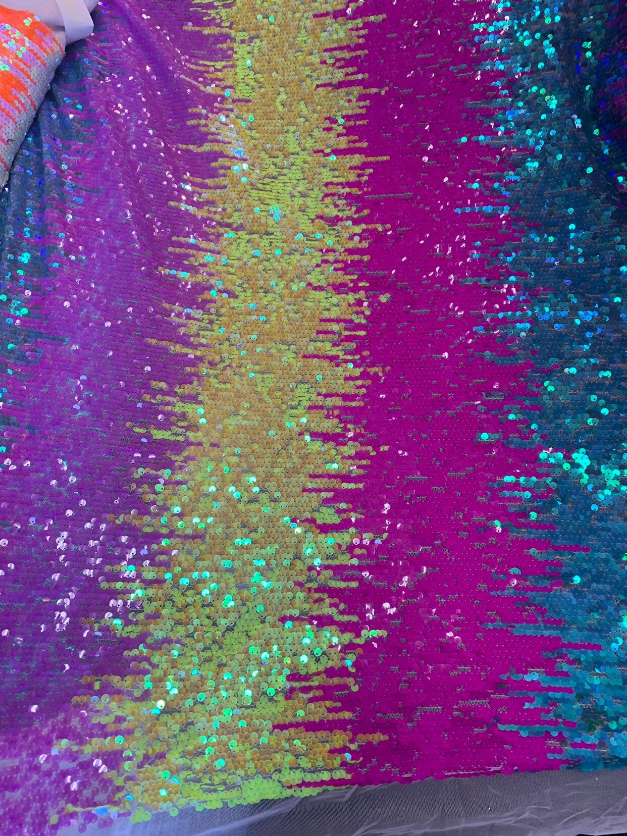 New iridescent multicolor rainbow sequins all over on stretch mesh 2way 58/60" Sold by the YD. Ships worldwide from Los Angeles California.