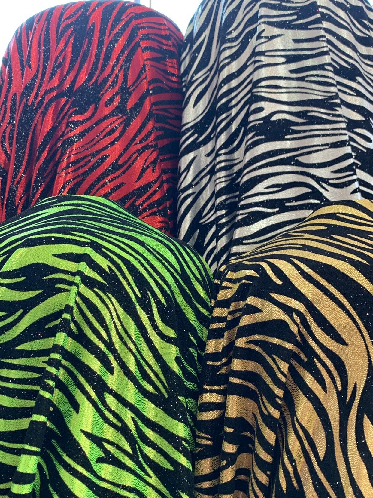 New zebra design with black flocking metallic nylon spandex 4-Way stretch 58/60" Sold by the YD. Ships worldwide from Los Angeles