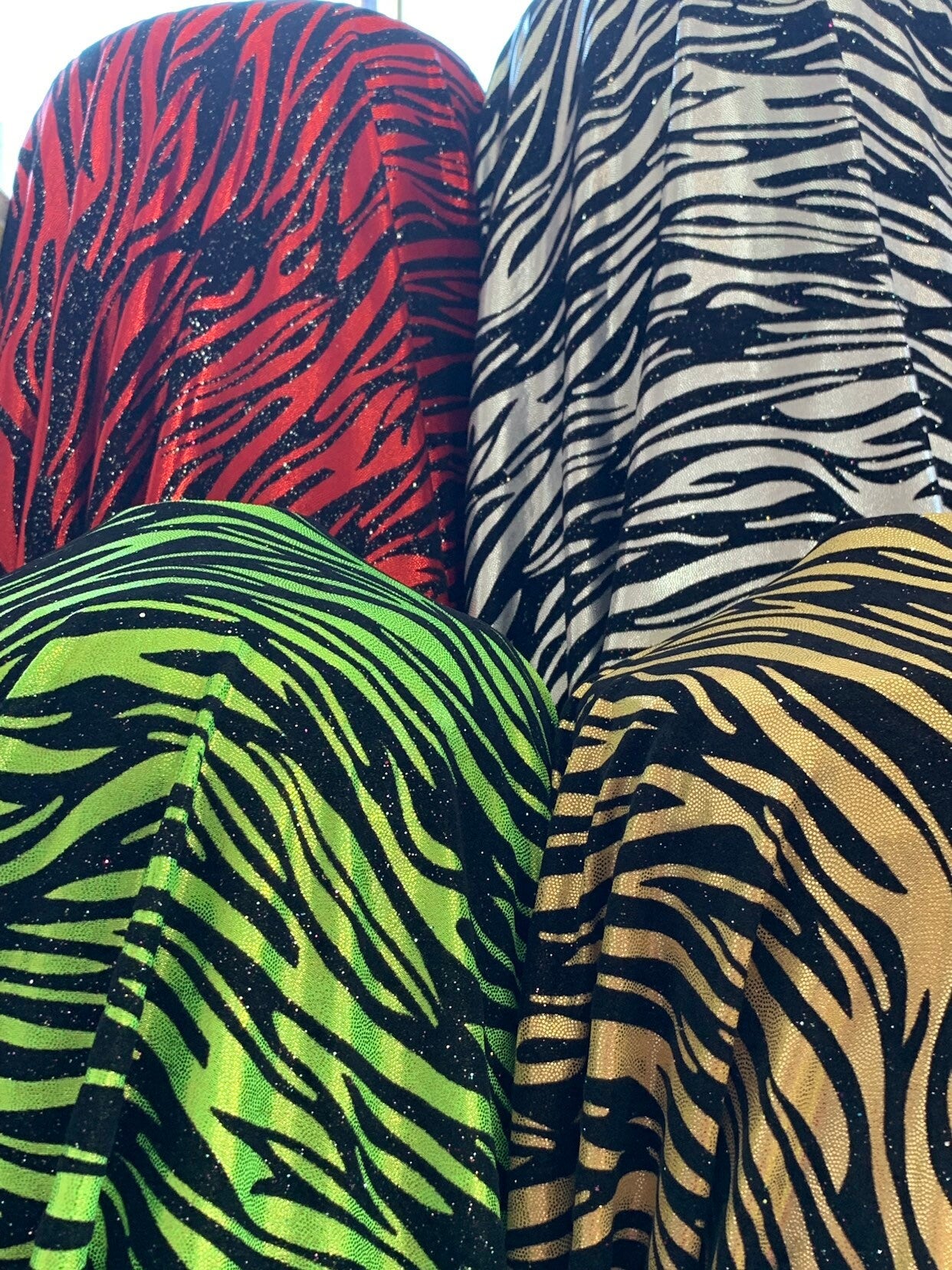 New zebra design with black flocking metallic nylon spandex 4-Way stretch 58/60" Sold by the YD. Ships worldwide from Los Angeles