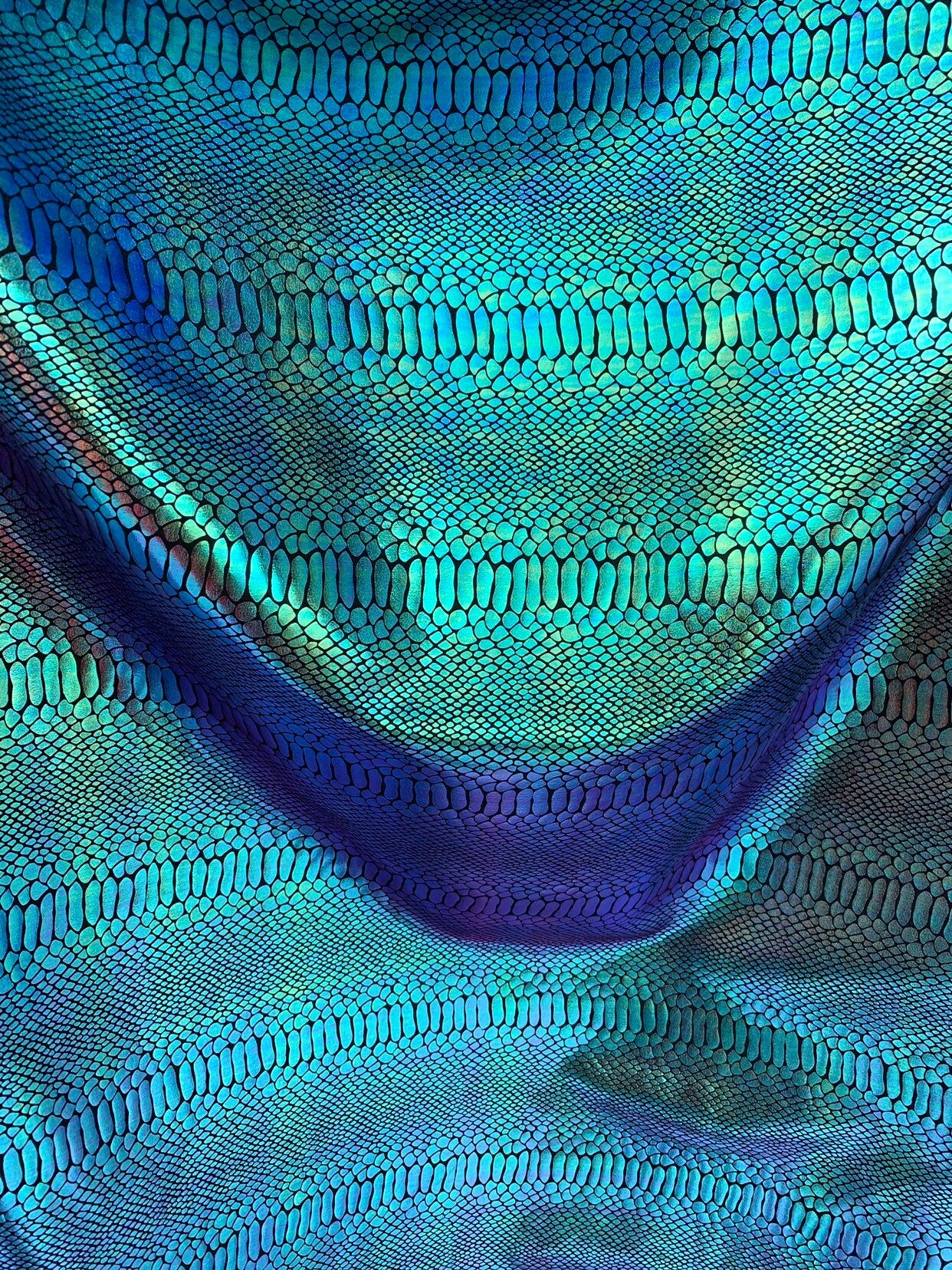 New Iridescent snake foil 2 tone blue/green metallic nylon spandex 4way stretch 58/60" Sold by the  YD. Ships worldwide from Los Angeles CA.