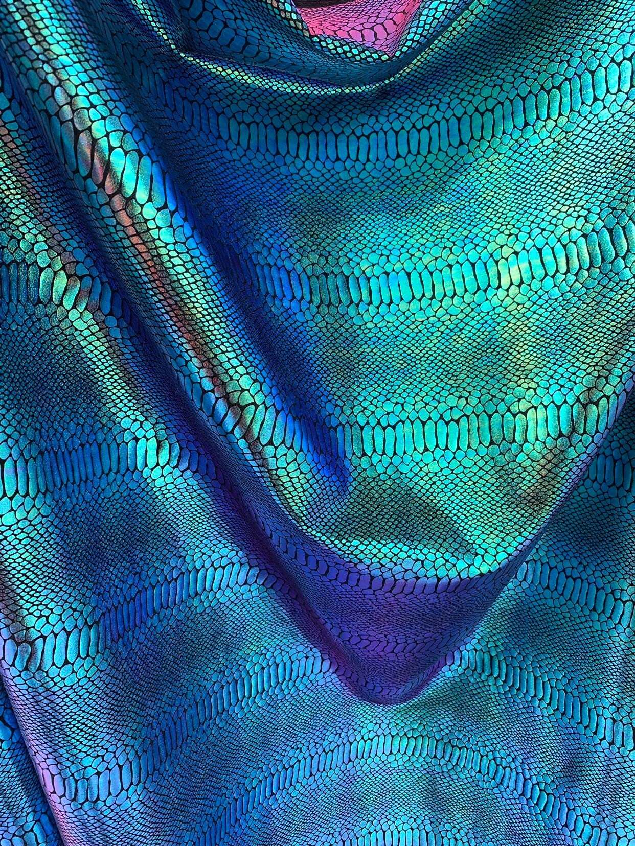 New Iridescent snake foil 2 tone blue/green metallic nylon spandex 4way stretch 58/60" Sold by the  YD. Ships worldwide from Los Angeles CA.