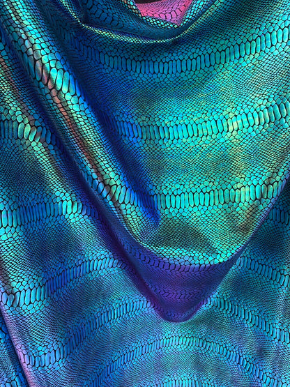 New Iridescent snake foil 2 tone blue/green metallic nylon spandex 4way stretch 58/60" Sold by the  YD. Ships worldwide from Los Angeles CA.