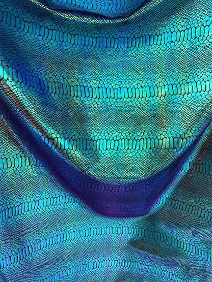 New Iridescent snake foil 2 tone blue/green metallic nylon spandex 4way stretch 58/60" Sold by the  YD. Ships worldwide from Los Angeles CA.