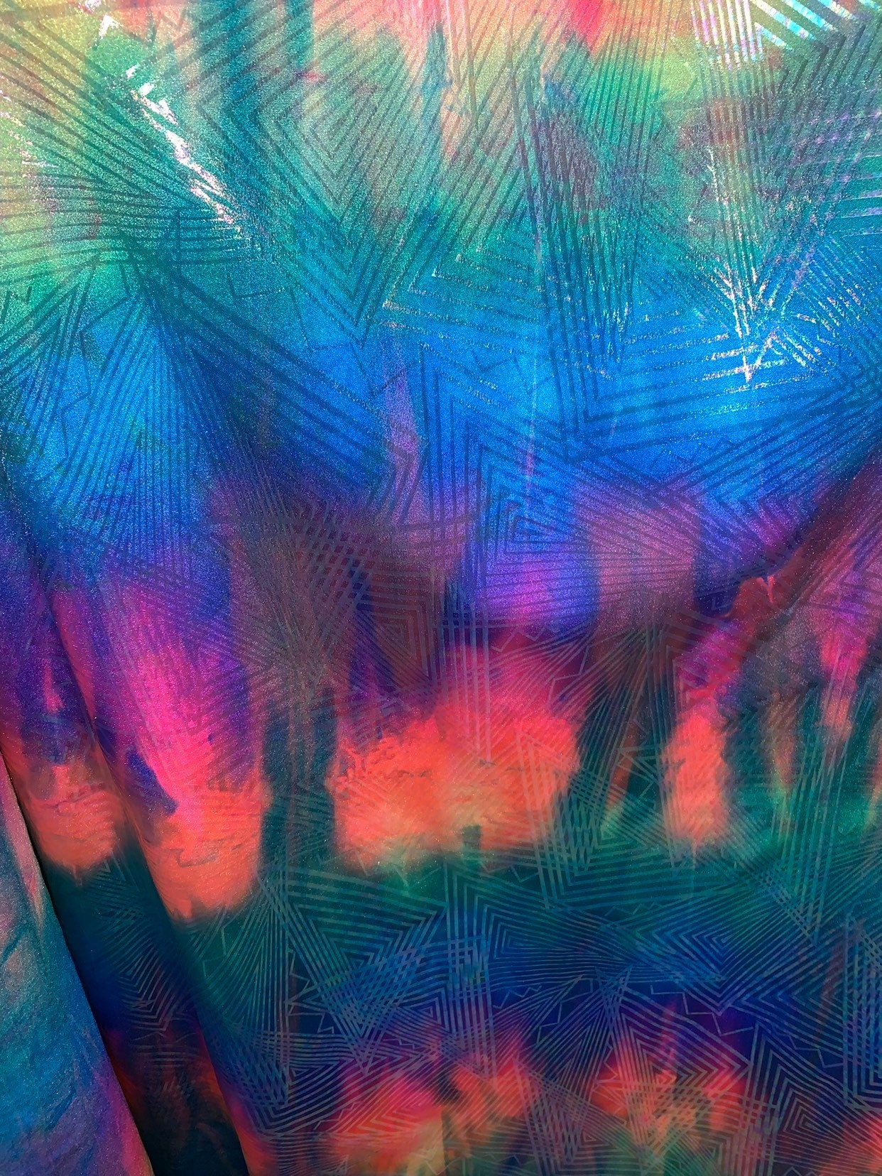 New tie dye rainbow geometric design with ilusión clear foil iridescent nylon spandex 4way stretch 58/60" Sold by the YD. Ships worldwide