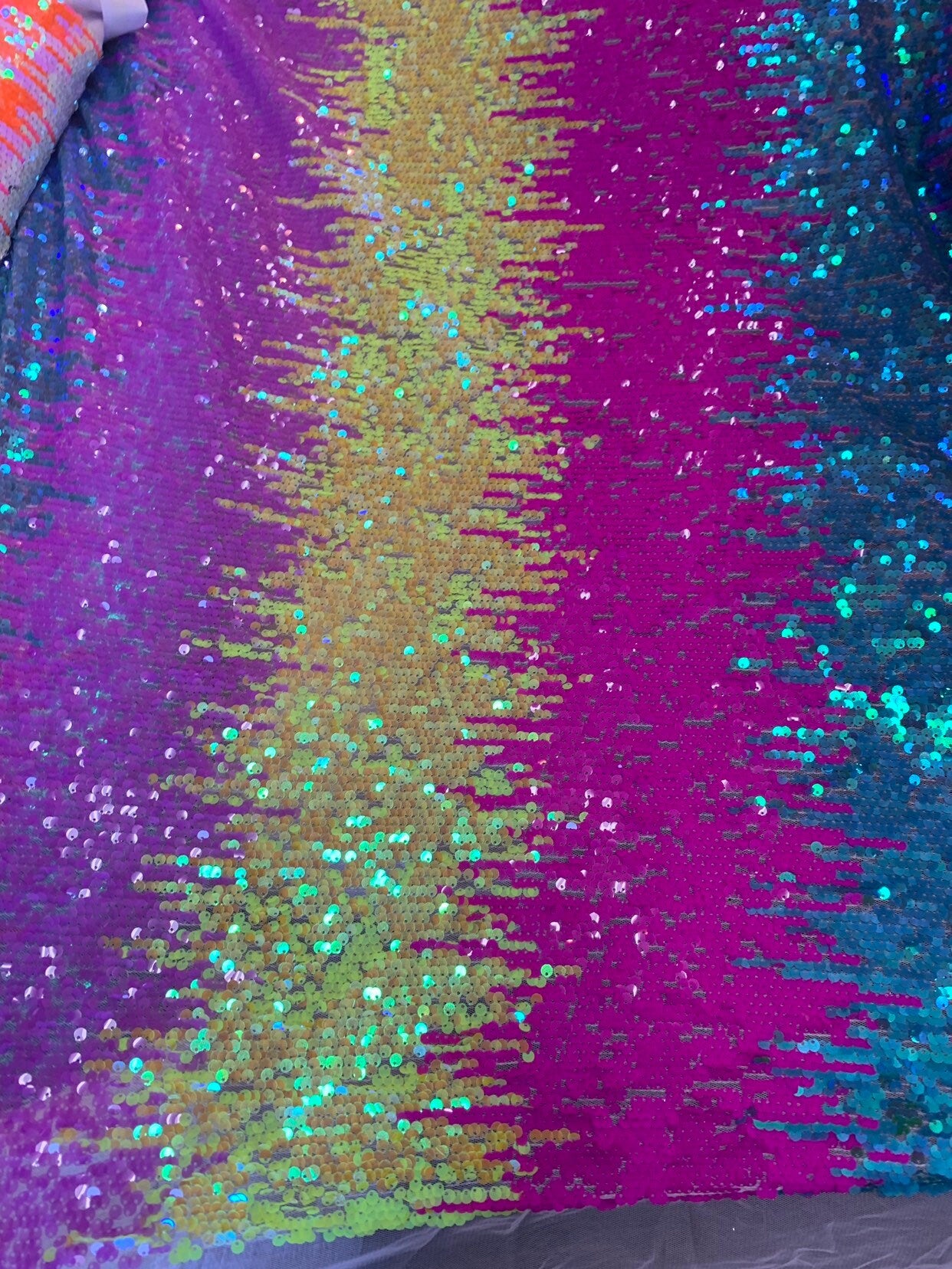 New iridescent multicolor rainbow sequins all over on stretch mesh 2way 58/60" Sold by the YD. Ships worldwide from Los Angeles California.