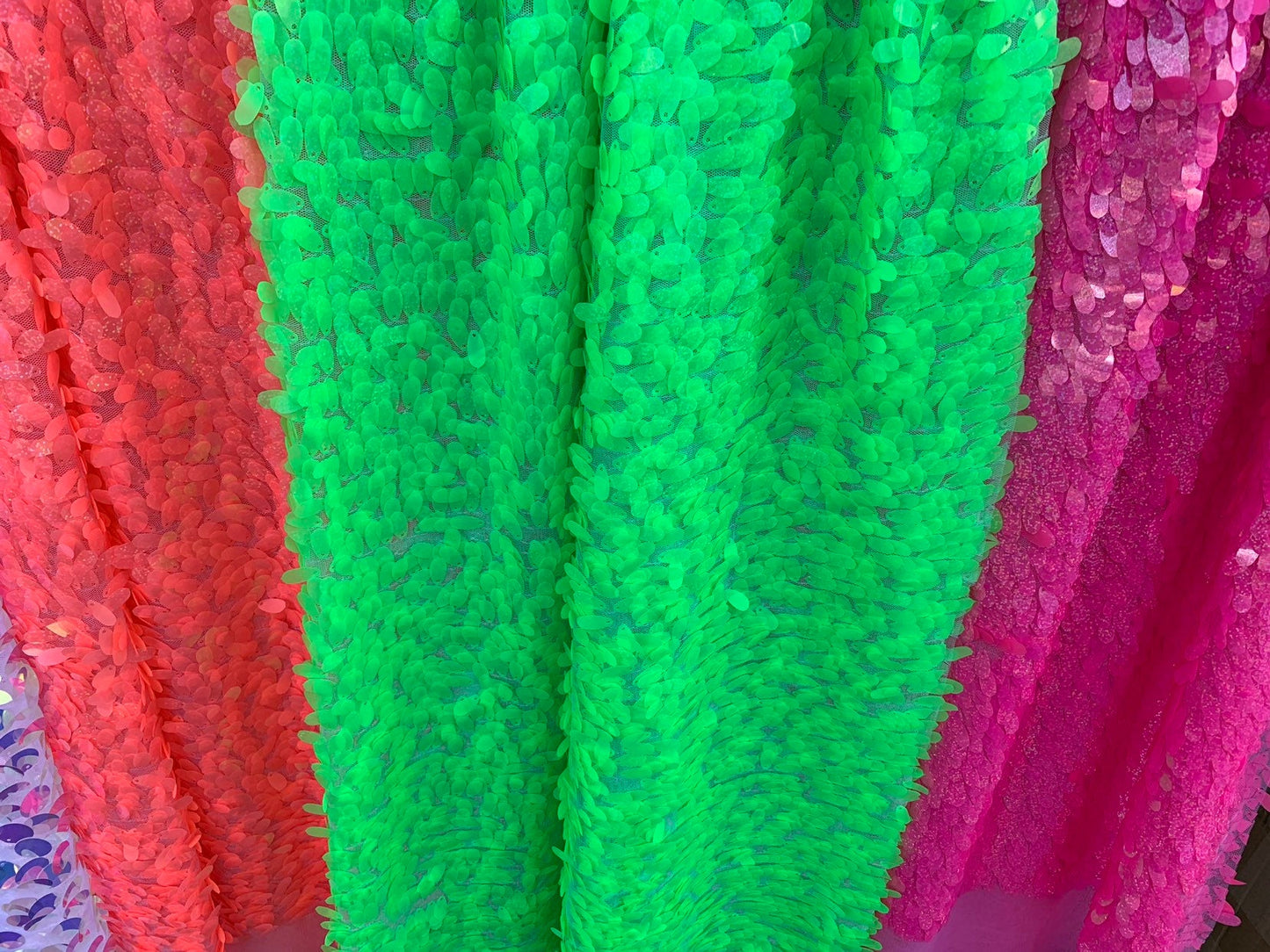 New teardrops sequins medium size neon colors shining sequins on stretch mesh 55/57" Sold by the YD. Ships worldwide from Los Angeles CA USA