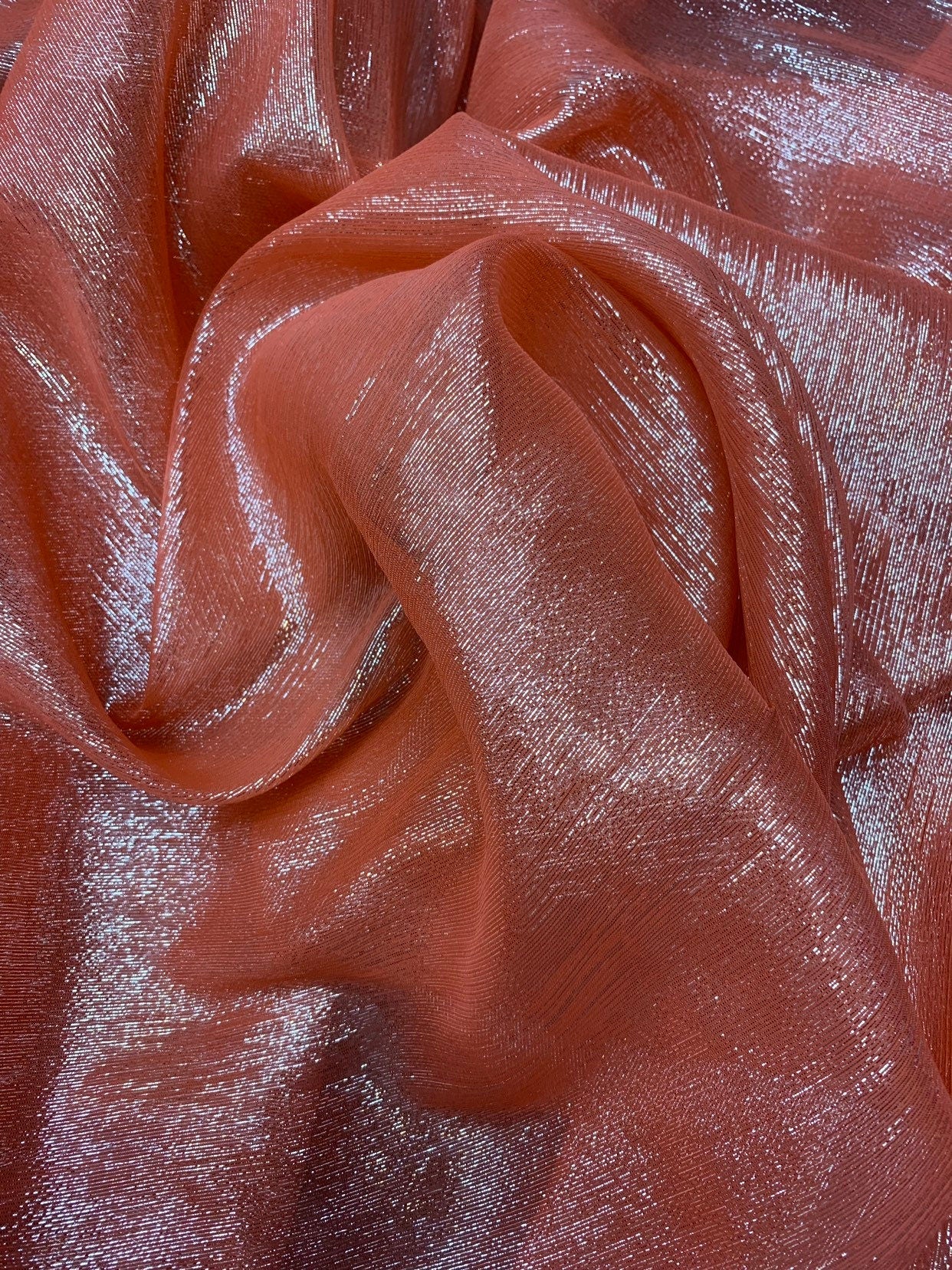 Silk metallic chiffon coral/silver 2way Stretch 44/45" Sold by the YD. Ships worldwide from Los Ángeles California USA.