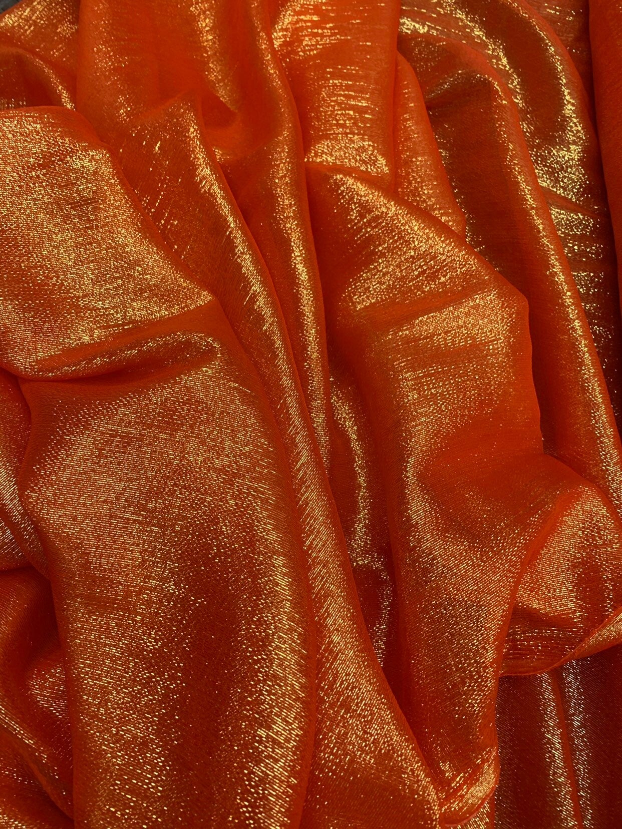 Silk metallic chiffon orange/gold 2way Stretch 44/45" Sold by the YD. Ships worldwide from Los Ángeles California USA.