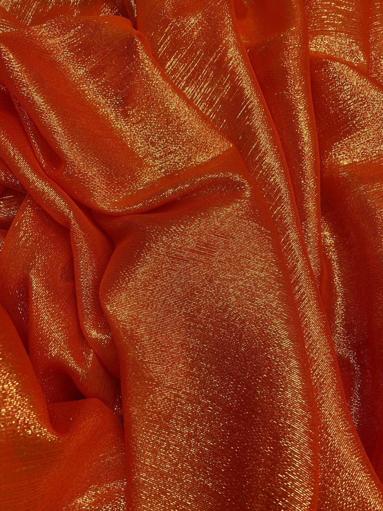 Silk metallic chiffon orange/gold 2way Stretch 44/45" Sold by the YD. Ships worldwide from Los Ángeles California USA.