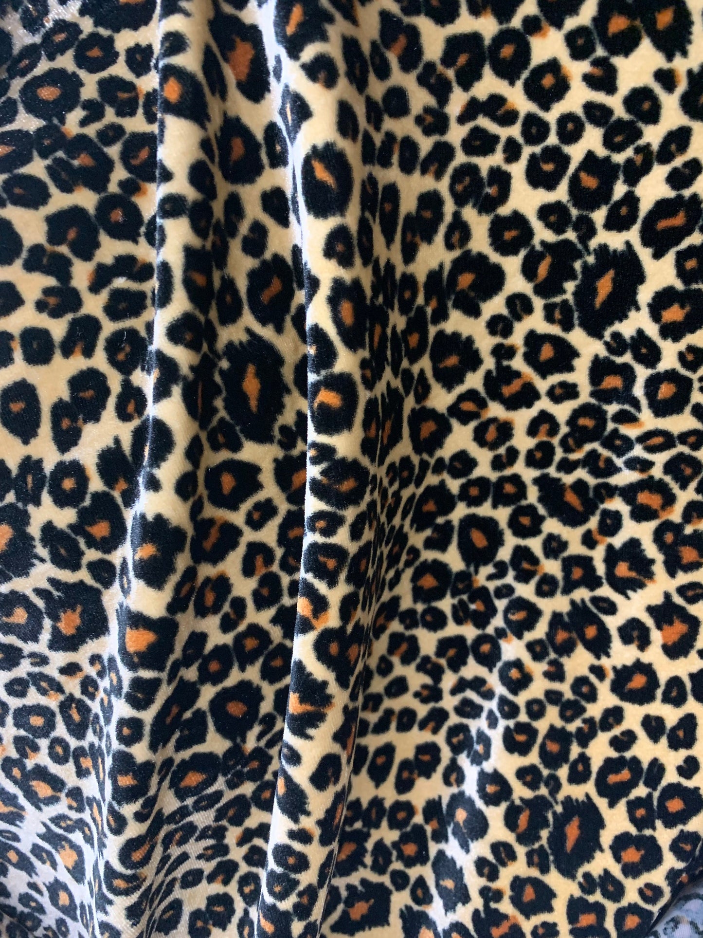 New premier exotic Leopard design print on stretch velvet 4-way 58/60" Sold By The YD. Ships worldwide from Los Angeles California USA.