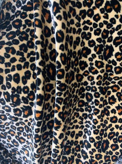 New premier exotic Leopard design print on stretch velvet 4-way 58/60" Sold By The YD. Ships worldwide from Los Angeles California USA.